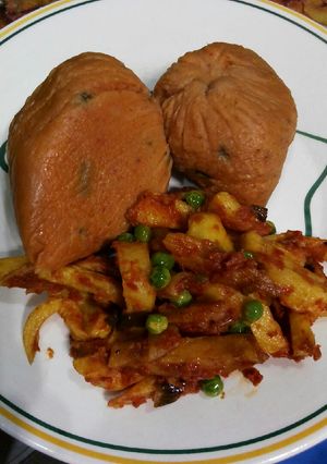 A picture of Moi moi with fried chips sauce.