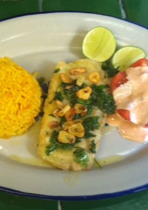 Una foto de Pescado al ajillo con cilantro