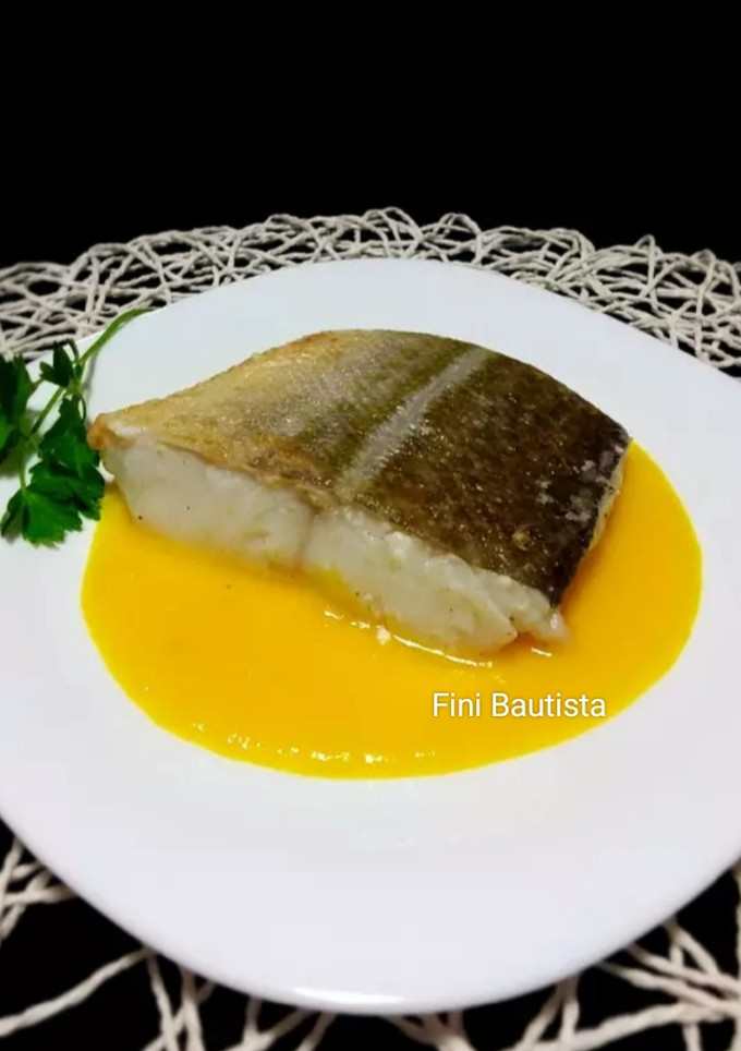 Una foto de Bacalao con salsa de pimientos