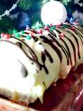 Enrollado o brazo de gitano con crema de naranja y chocolate