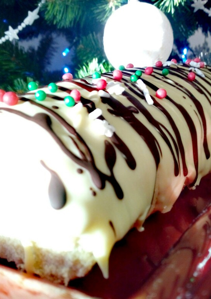 Una foto de Enrollado o brazo de gitano con crema de naranja y chocolate