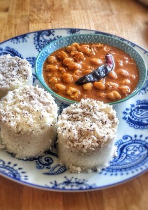 A picture of Puttu kadala (steamed rice cake and chickpea curry)Kerala Breakfast.