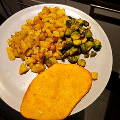 A picture of Roasted potatoes & brussel sprouts.