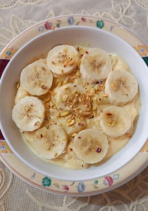 A picture of Fruity custard 🍎🍌🍎🥜.