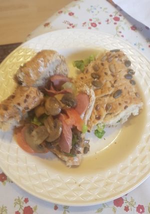 A picture of Mushroom and sausage sandwich.