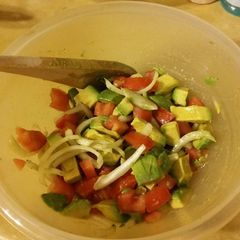 A picture of Tomato Avocado Salad in honey lime dressing.