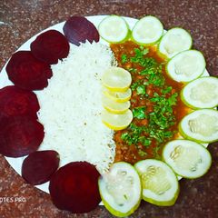 A picture of Kaale chane and jeera rice plate.