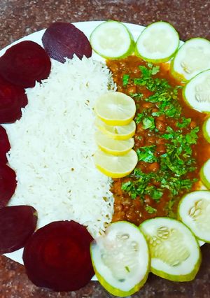 A picture of Kaale chane and jeera rice plate.