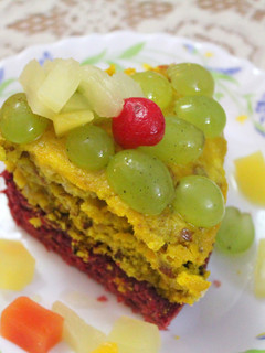 A picture of Red Velvet and Nuts cake with Warm Cocktail syrup dressing.