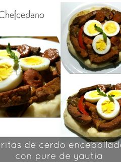 Una foto de Tiritas de cerdo encebollado con puré de yautia