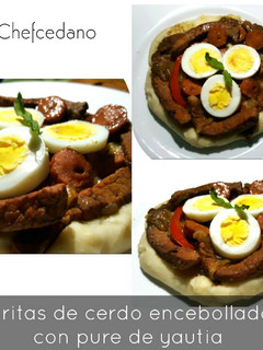 Una foto de Tiritas de cerdo encebollado con puré de yautia