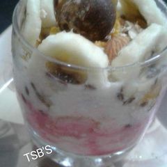 A picture of Granola Yoghurt Fruits & Nuts Parfait.