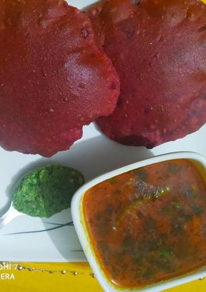 A picture of Beetroot poori and potato sabzi with spicy chutney.
