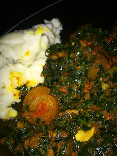 A picture of Pounded yam and vegetable soup.