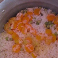 A picture of Rice with veggies.