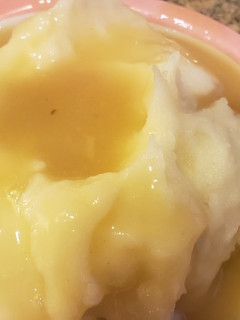 A picture of Vegan mashed potatoes and gravy.