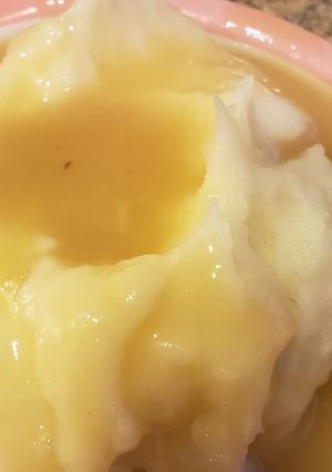 A picture of Vegan mashed potatoes and gravy.