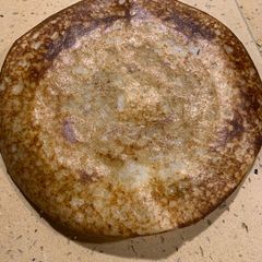 A picture of Red poha Proso millet Dosa.