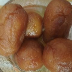 A picture of Bread Gulab Jamun stuffed with dry fruits.