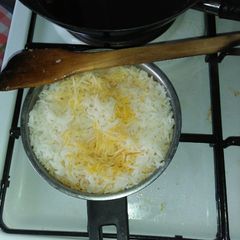 A picture of Boiled rice in Palm oil.