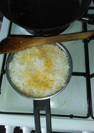 A picture of Boiled rice in Palm oil.