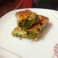 A picture of Spinach paneer chana dal wrap.