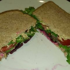 A picture of Spicy Hummus salad sandwich.