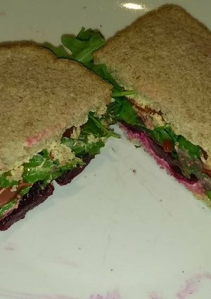 A picture of Spicy Hummus salad sandwich.
