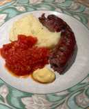 Boerewors with mashed potatoes served with a tomato chili relish