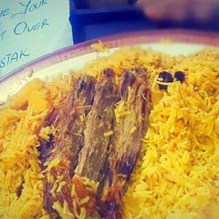 A picture of Zafrani rice with meat.