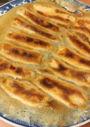 A picture of Crispy Vegetable Potstickers with Lacy Skirt.