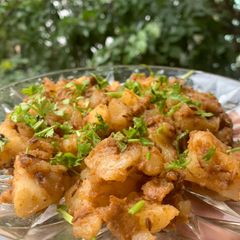 A picture of Ghee aloo jeera roast with anardana powder.