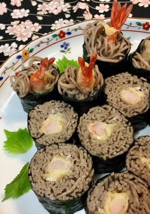 A picture of Soba noodle Roll Sushi with shrimp Tempura.