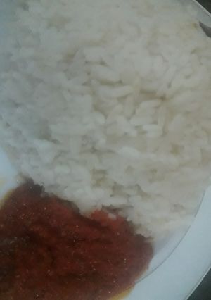 A picture of White rice and stew.