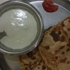A picture of Corn spinach cheesy pocket parathas.