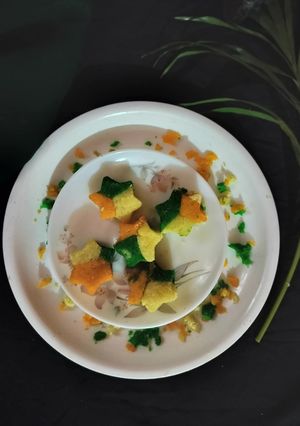 A picture of Tri colour star shape semolina sandesh.