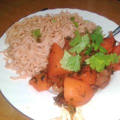 A picture of Indomie with boiled red meat.
