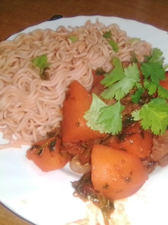 A picture of Indomie with boiled red meat.