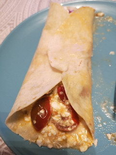 Una foto de Fajita de tomates provenzales y queso cottage