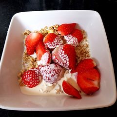 A picture of My Granola and fresh sliced strawberries +Cream ❣️.