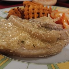 A picture of Pork Chops Cooked in Milk and Herbs.