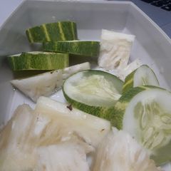 A picture of Diced pineapple and Cucumber.