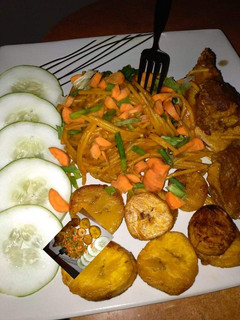 A picture of Pasta,fried plantain and veggies.