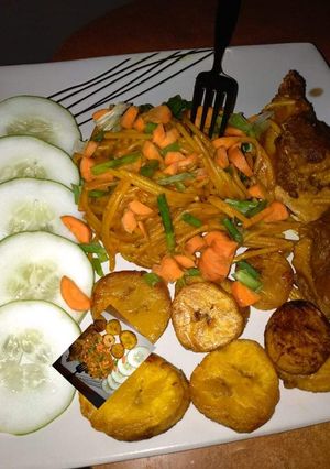 A picture of Pasta,fried plantain and veggies.