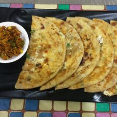 A picture of Stuffed urad,chana dal and paneer malai parathe.