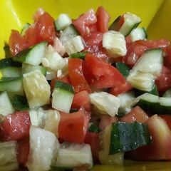 A picture of Cucumber and tomato salad.