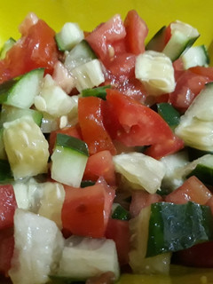 A picture of Cucumber and tomato salad.