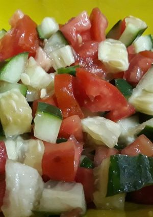 A picture of Cucumber and tomato salad.