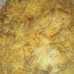 Chicken biryani and raita A picture of Chicken biryani and raita.
