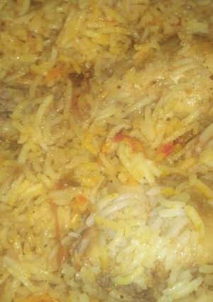 A picture of Chicken biryani and raita.